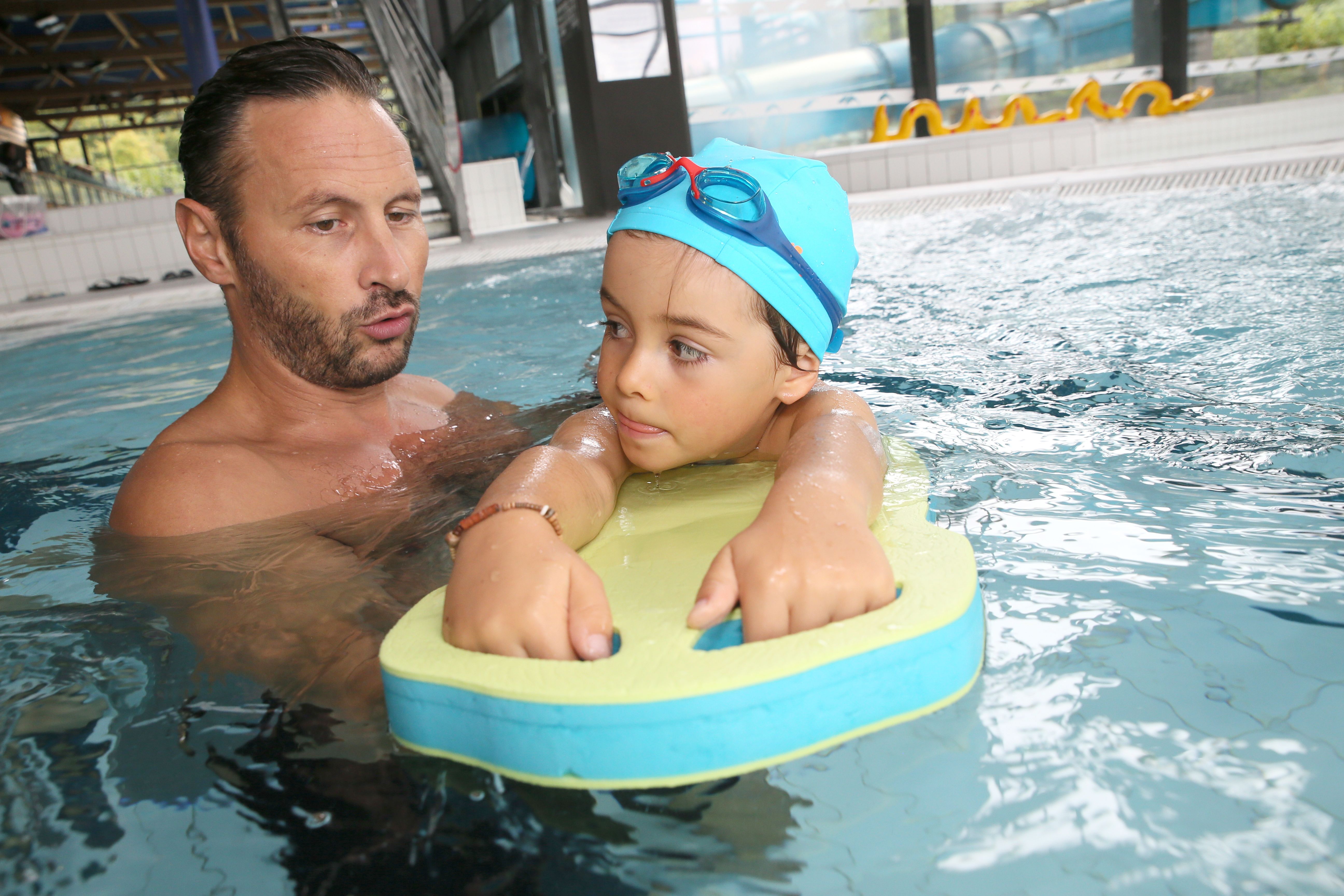 Father teaching his child to be water safe