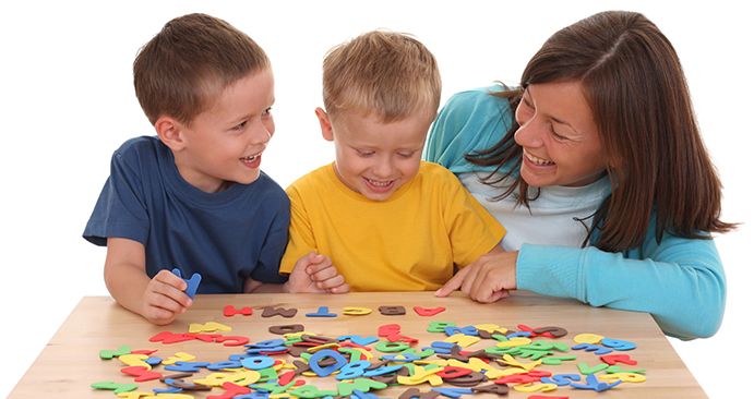 Therapist teaching a special needs child to communicate