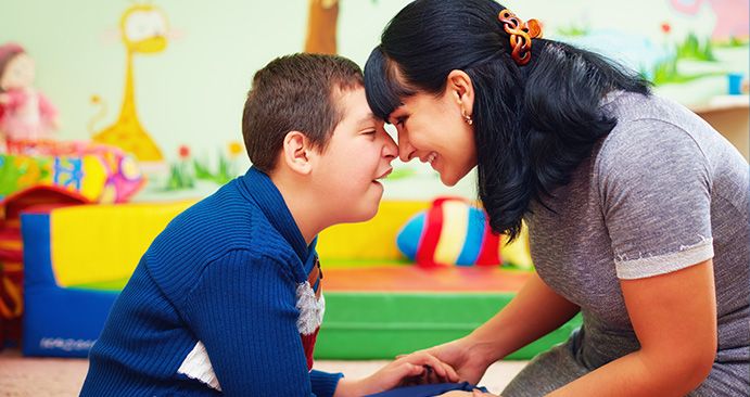 Mother and child with special needs at school