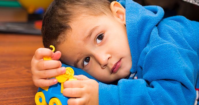 Child with autism playing with a toy