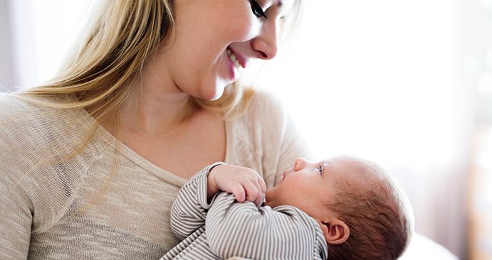 A mother holding her baby