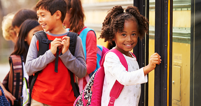 Children with autism waiting for the school bus