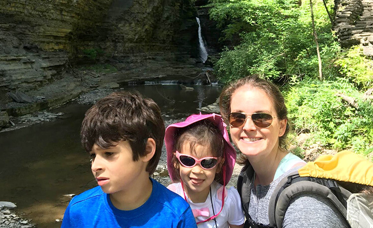 family with autistic child outdoors