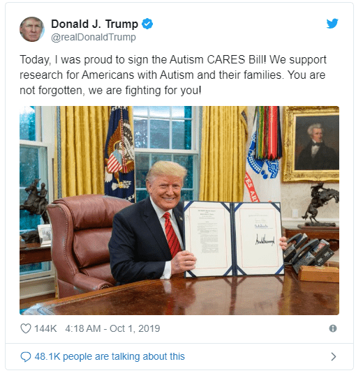 President Donald signing the Autism Cares Bill