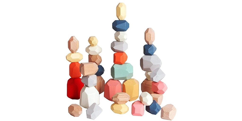 Stimulates autistic kids' motor and visual-spatial skills playing Wooden Stacking Rocks